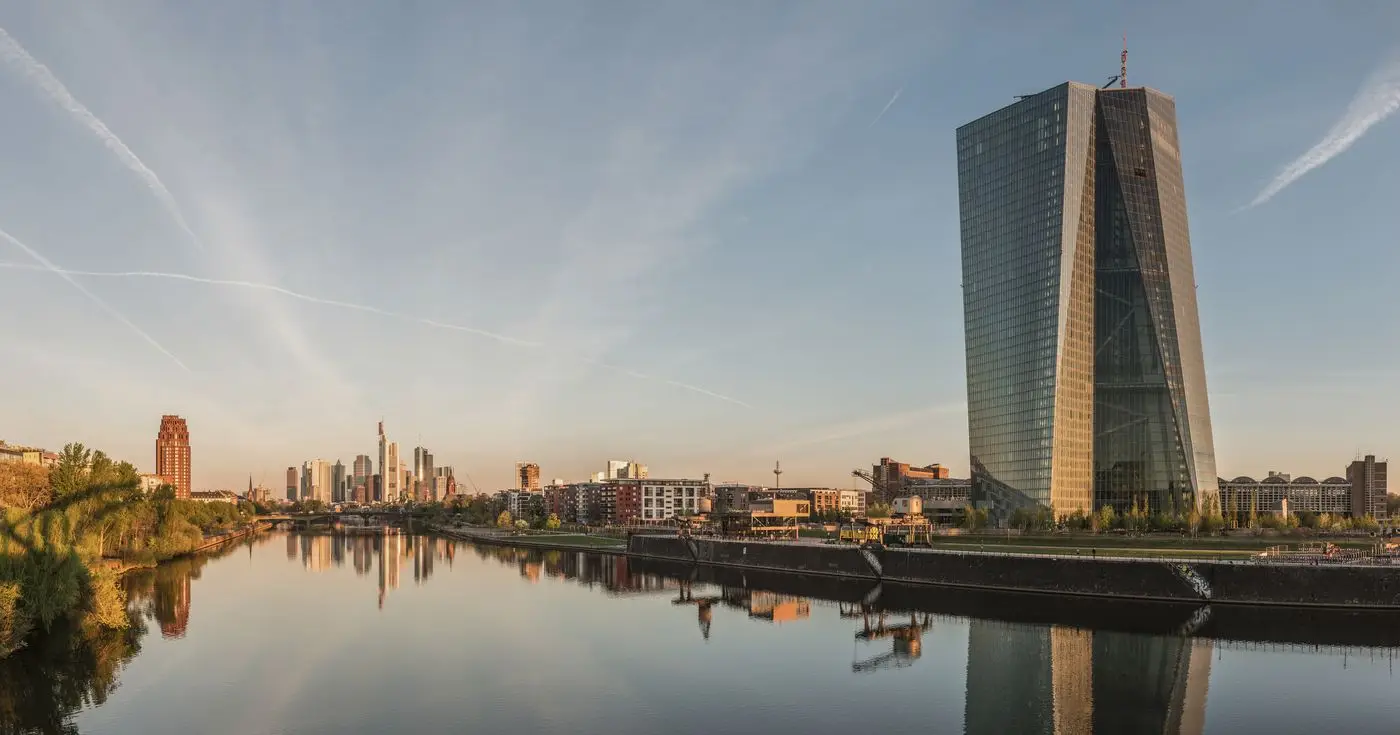 The European Central Bank headquarters and Frankfurt skyline at dawn